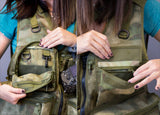 Insider pockets of custom camo photography vest